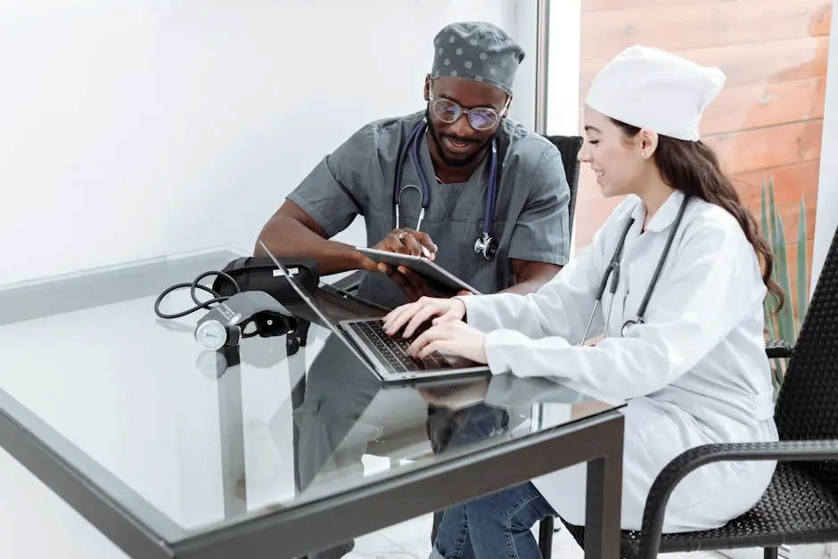 Doctor team discussion on laptop and tablet