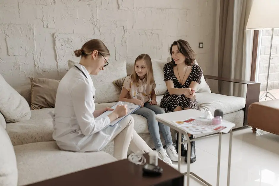 A doctor consulting with a mother and child.