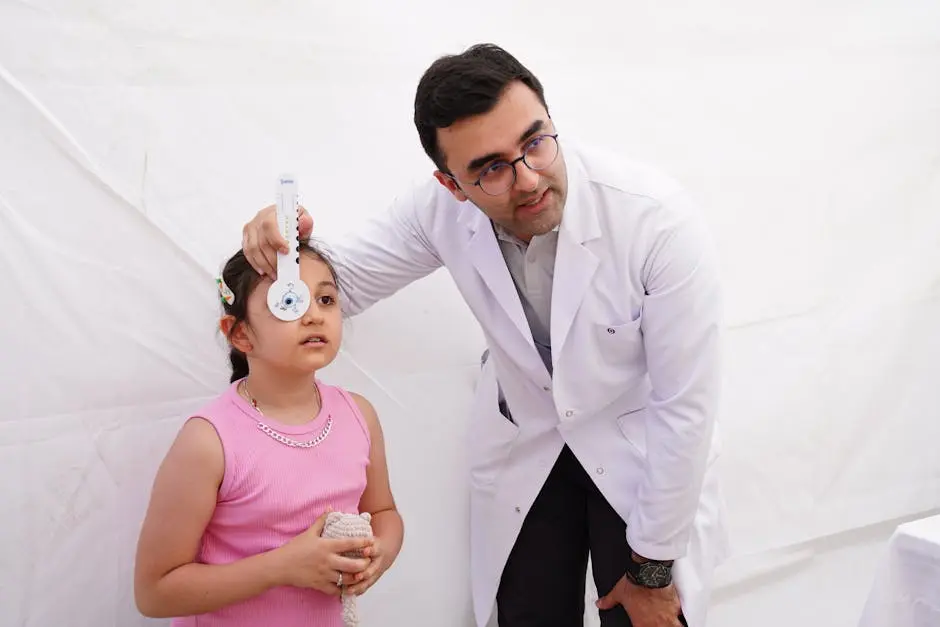 An optometrist checking a child's eye.